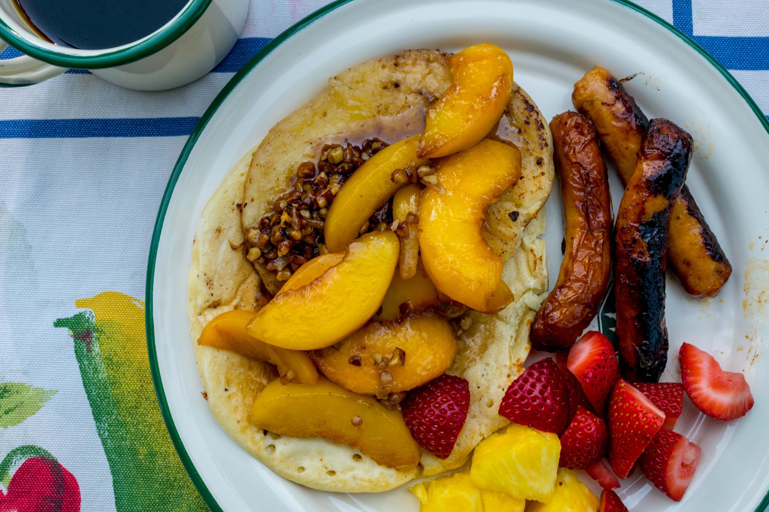 Pancakes with campfire-roasted peaches
